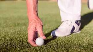marking lifting golf ball