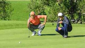 men on golf putting green