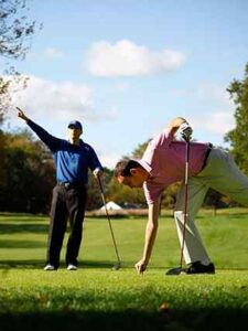 Men Teeing Off